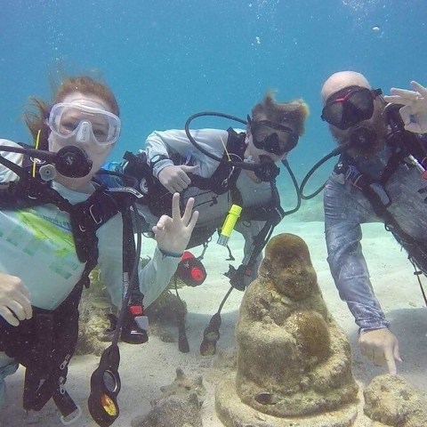 a couple of people that are sitting in the snow
