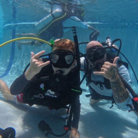 a group of people swimming in a body of water