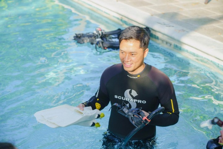 a person riding a surf board on a body of water