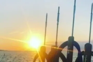 a sunset over a body of water